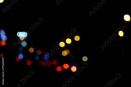 Abstract blurred of blue and silver glittering shine bulbs lights background:blur of Christmas wallpaper decorations concept.christmas light night