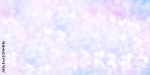 Winter shiny snowflakes blurred background in light blue pink colors
