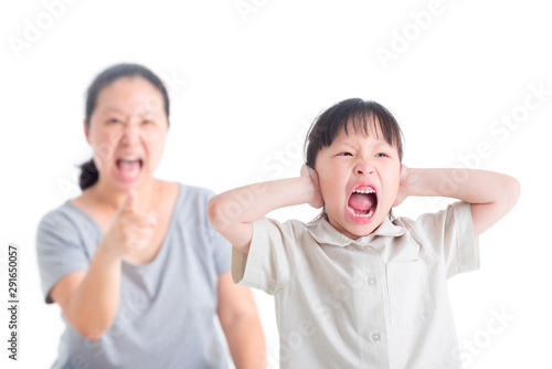 Displeased Girl covering her Ears from Scolded by her mother and screaming on white background
