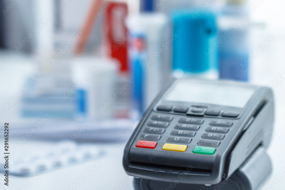 card paying terminal on the medications background card paying terminal on the medications background