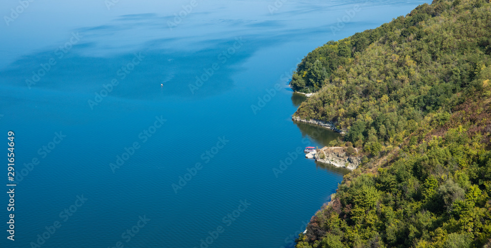 aerial landscape top view lake blue water and mountain forest green scenic shore line, natural wallpaper poster photography with empty copy space for text 