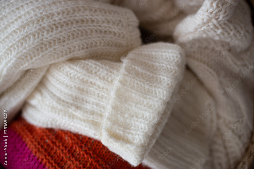 basket of woolen clothes. autumn and winter concept basket of woolen clothes. autumn and winter concept