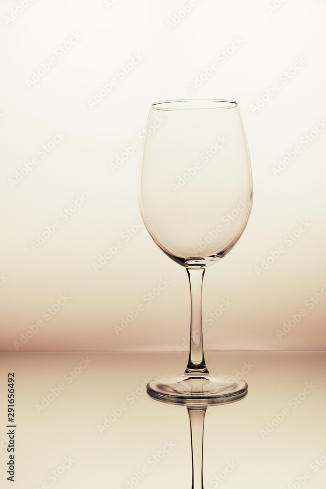Fototapeta premium wine empty glasses on soft beige background