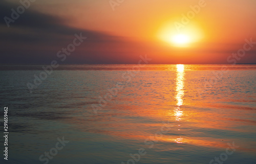 Fototapeta Naklejka Na Ścianę i Meble -  Beautiful colorful sunset on the sea coast. Nice scene with sunrise over water