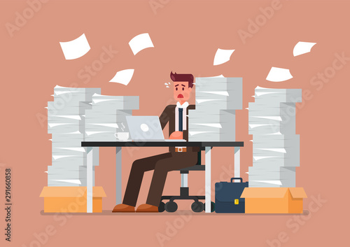 Busy overworked man sitting at table with laptop and pile of papers in office