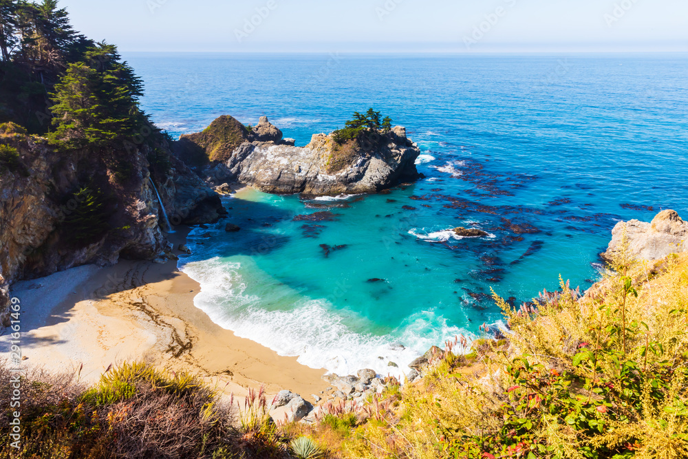 Stunning view of McWay falls on the coast of Big Sur in central California that flows year-round into the Pacific Ocean