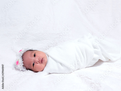 little girl on white blanket