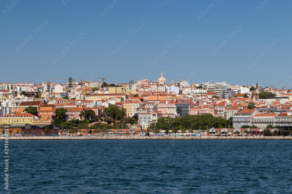City of Lisbon, Portugal, viewed from the Tagus River on a sunny day. Copy space.