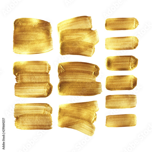 Golden paint brush stroke smear set isolated on white background