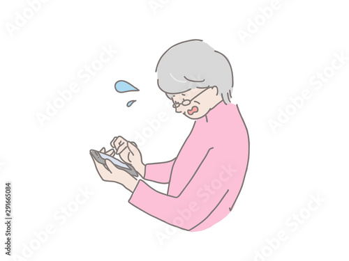 スマートフォンを操作する年配女性　焦る