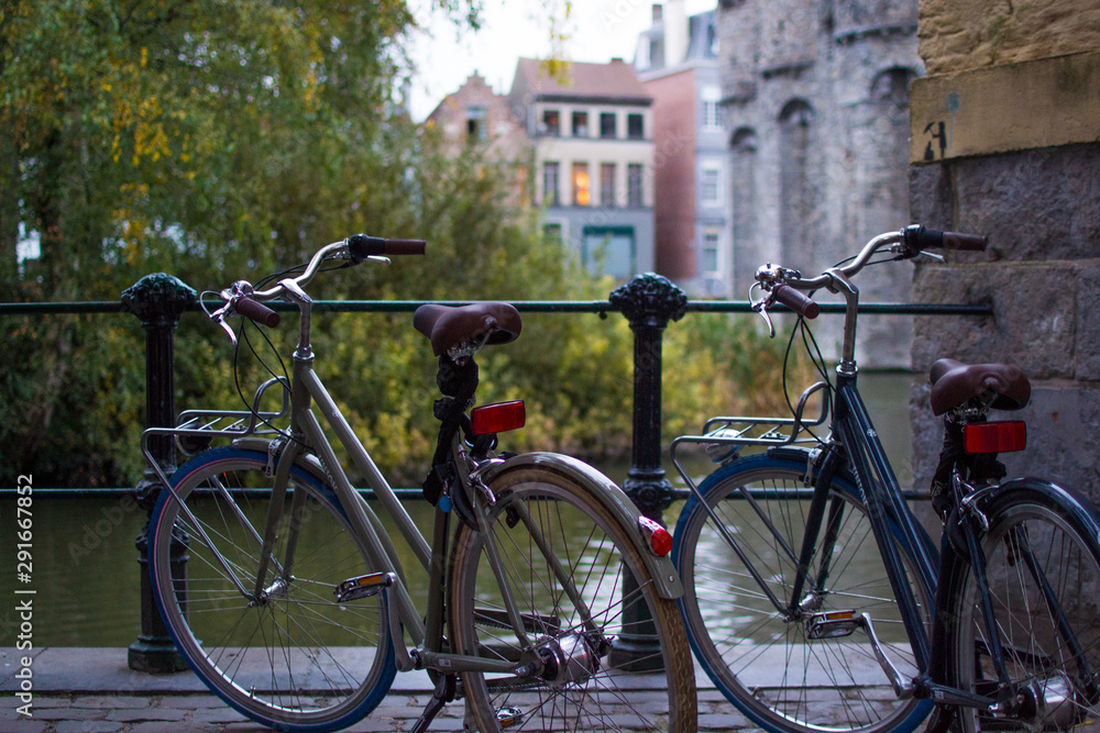 Ghent, Belgium; 10/29/2018: Rear part of two classic comfort bikes parked with a defocused background