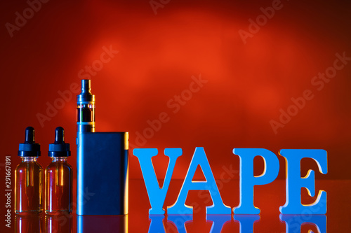 Vape logo.Vape smoking instead of nicotine. The letters vape on the table.Concept Refusal of nicotine addiction. Liquids for vaper. E-Sigs. Kit for the vaper.Shop for the vaper.Refusal of cigarettes