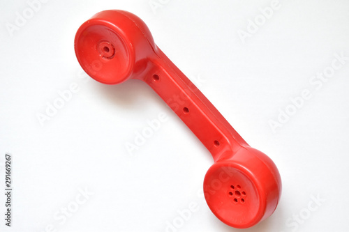 red telephone receiver on a white background