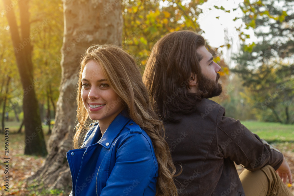 Fototapeta premium Couple in the park enjoying nice autumn time.