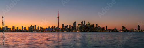 Panorama of Toronto at sunset with CN Tower over Ontario Lake, Canada