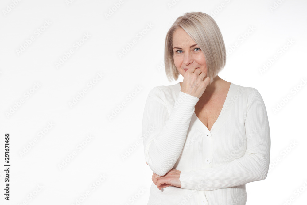 Happy woman emotionally posing in a studio. Happy woman in yellow bright sweater on white background Happy woman emotionally posing in a studio. Happy woman in yellow bright sweater on white background