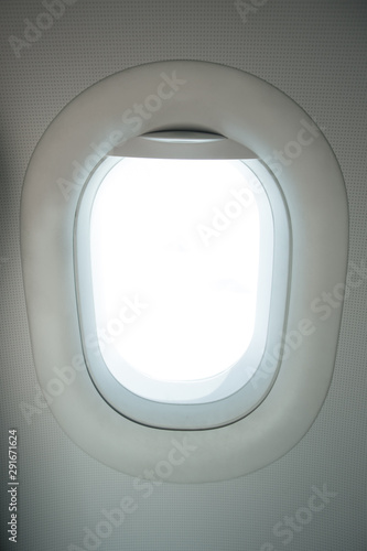 Airplane window with white blank space for travel images. 