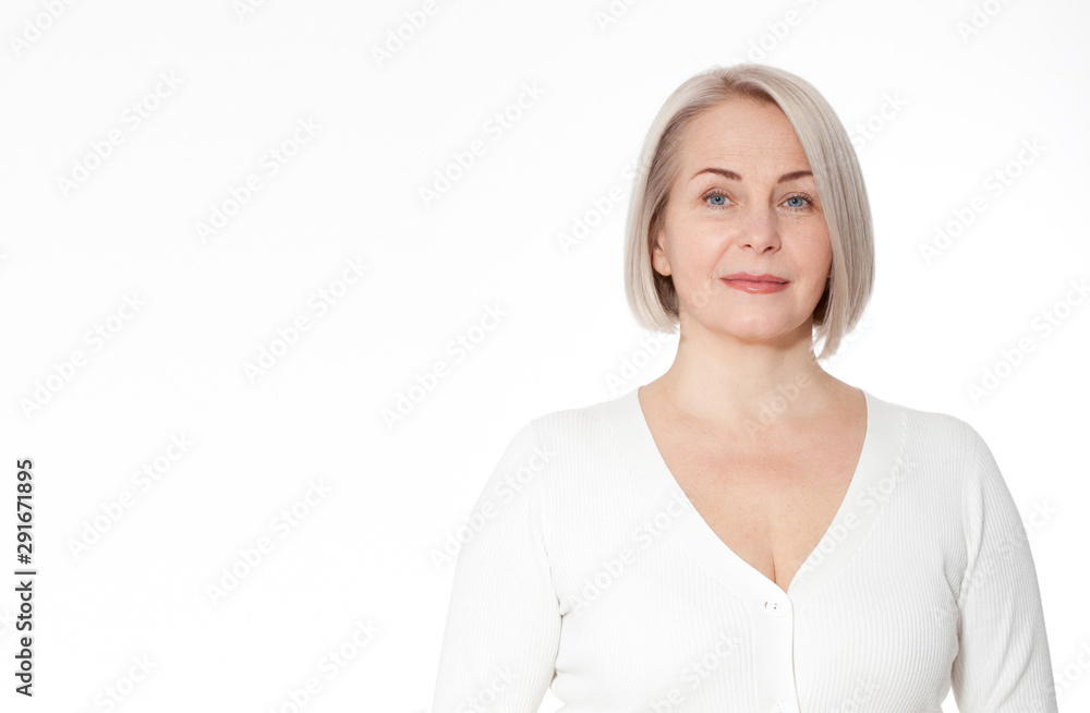 Happy woman emotionally posing in a studio. Happy woman in yellow bright sweater on white background Happy woman emotionally posing in a studio. Happy woman in yellow bright sweater on white background