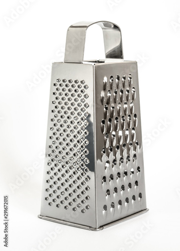shiny metal new grater isolated on white background, close-up cheese and food grater photo