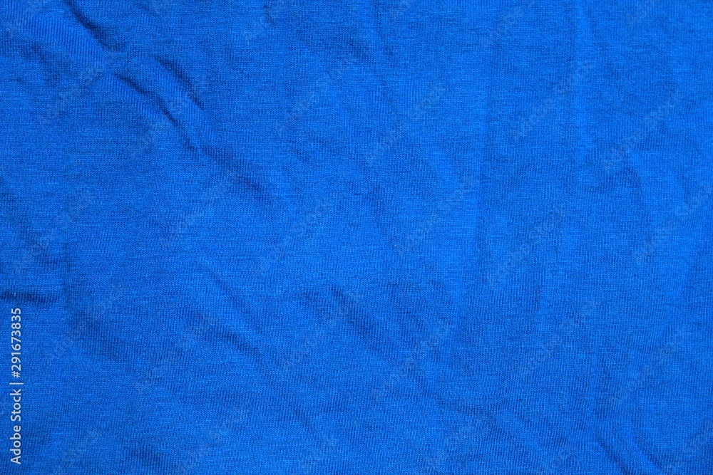 Abstract wrincled blue textile background or texture