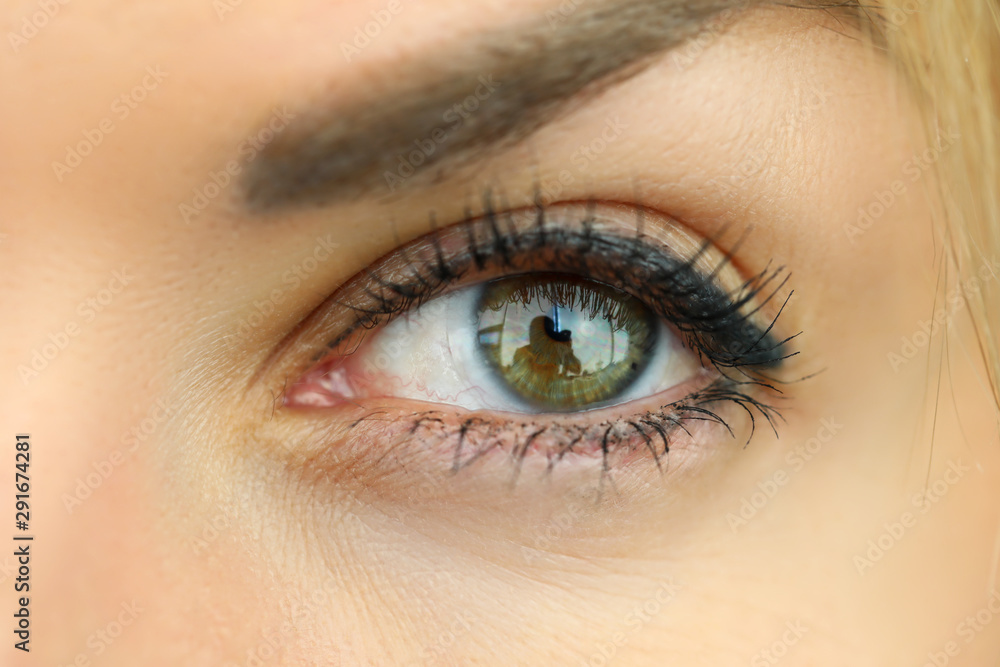 Amazing emerald wide opened left eye with contact lens Amazing emerald wide opened left eye with contact lens