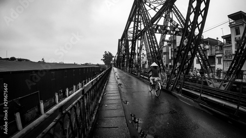 long bien bridge in hanoi with single biker