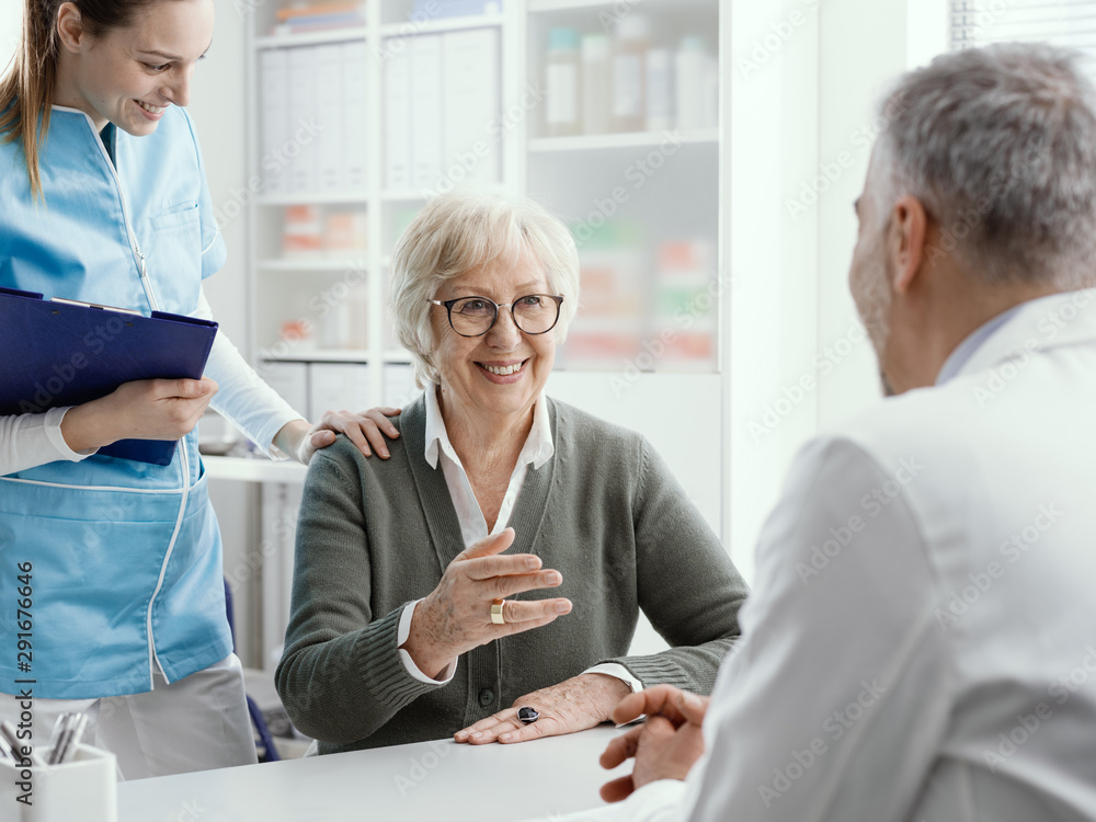 Smiling senior woman meeting the doctor in his office Smiling senior woman meeting the doctor in his office