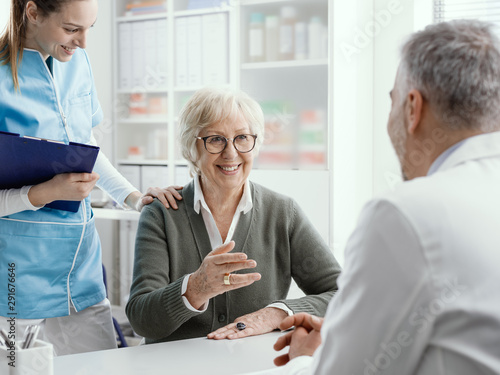 Smiling senior woman meeting the doctor in his office