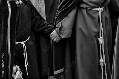 Interlaced hands in a procession, Holy Week