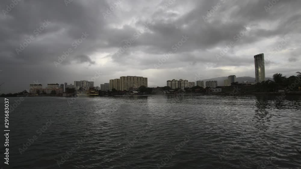 KOMTAR,Penang in the morning with rain dark cloud formed thicker and denser cause less sun light penetrate to the ground. KOMTAR,Penang in the morning with rain dark cloud formed thicker and denser cause less sun light penetrate to the ground.