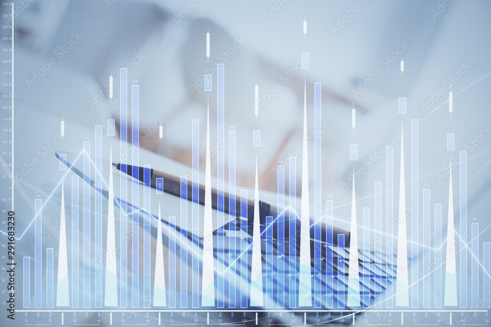 Forex Chart hologram on table with computer background. Double exposure. Concept of financial markets. Forex Chart hologram on table with computer background. Double exposure. Concept of financial markets.