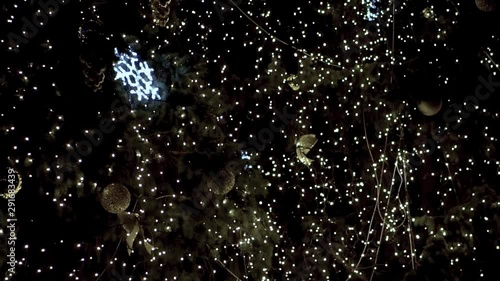 Beautiful diverse garlands on the street of the city of the new year and Christmas. Multi-colored bokeh in the winter. Stock video