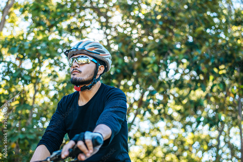 Mountain cyclists sit on bicycles and look to the front. Mountain cyclists sit on bicycles and look to the front.