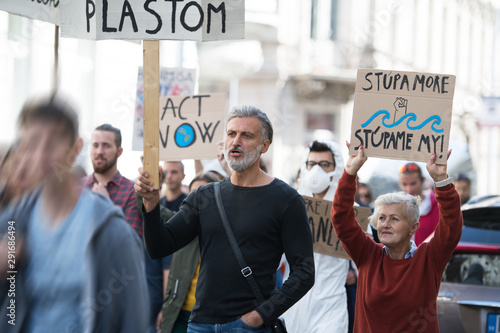 People with placards and posters on global strike for climate change. © Halfpoint