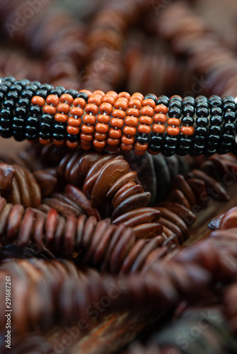 A close-up shot of African beads higlights the stunning detail, beautiful patterns and rich earthy colours of the African continent photo