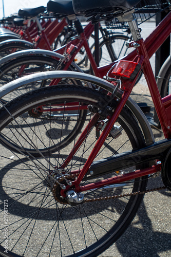 Close-up on public red bicycles in Bologna, Italy.