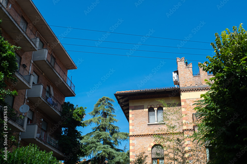 Suburban Bologna, Italy with trees and buildings.