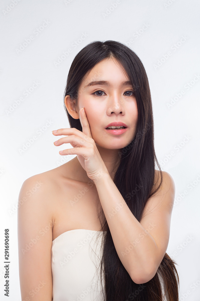 The woman wore a white strapless dress and hands touch her face. The woman wore a white strapless dress and hands touch her face.