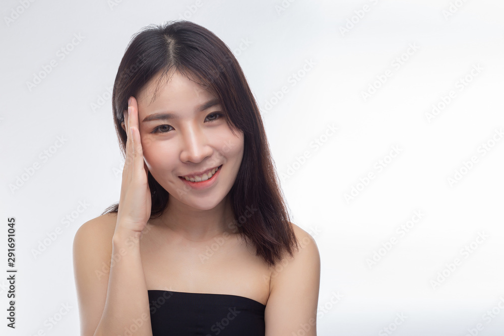 Women wearing black strapless blouses and hands touching the face on the eyebrows. Women wearing black strapless blouses and hands touching the face on the eyebrows.