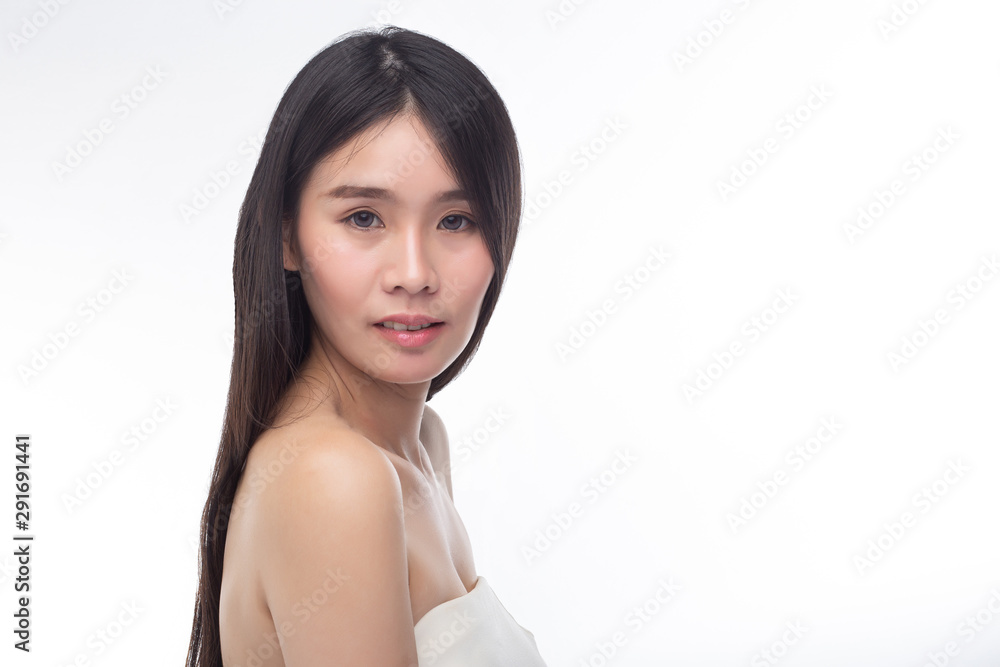 The women wear white strapless tops and face to the right. The women wear white strapless tops and face to the right.