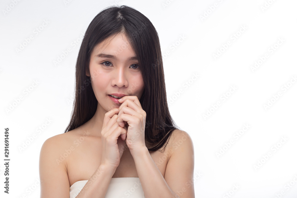 The women wear white strapless tops and put a finger at the edge of the mouth. The women wear white strapless tops and put a finger at the edge of the mouth.