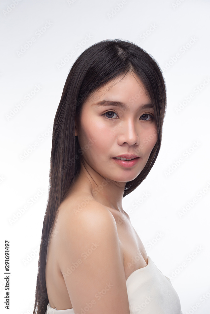 The women wear white strapless tops and face to the right. The women wear white strapless tops and face to the right.