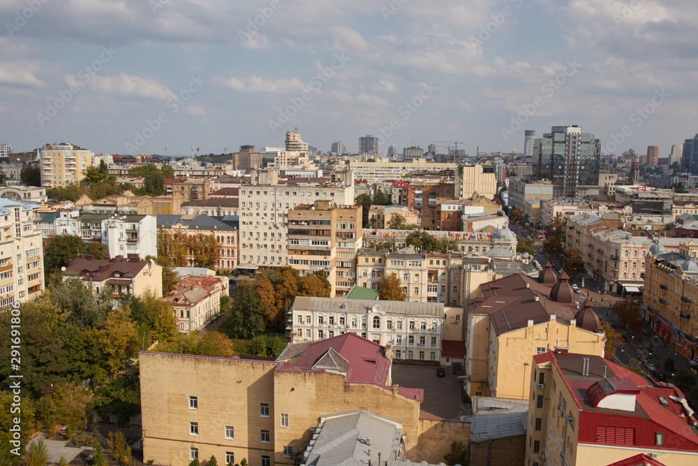 Architecture and buildings in Europe. The capital of Ukraine. Kiev city center. Street, roofs, buildings, travel, city center. Beautiful view of the city from above. Clouds over the city