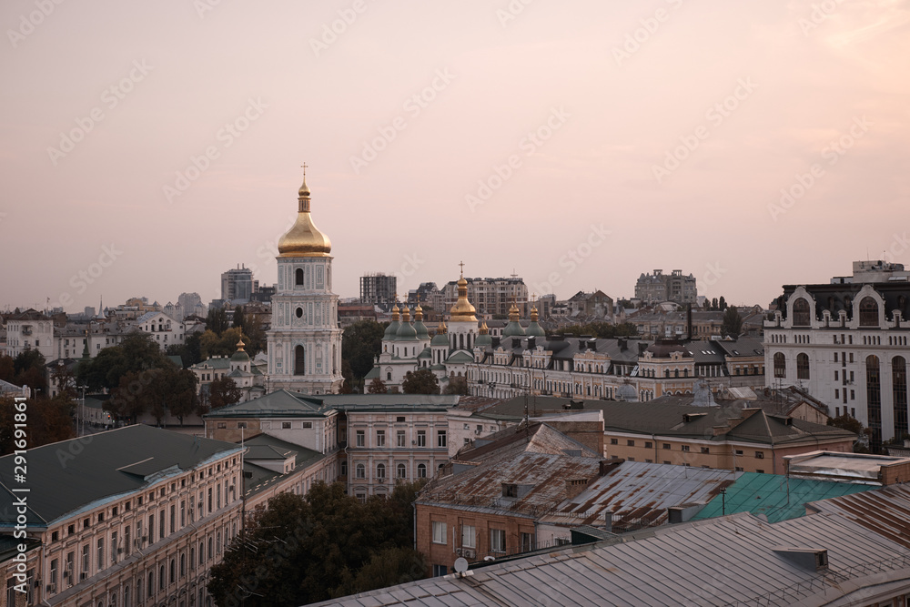 View overlooking the town. Kiev view into the distance to the city. Houses and buildings. Roofs of buildings. Cathedral in the city center. Streets, roof, houses, structures, a trip to Europe