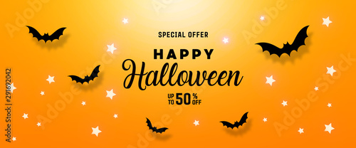 Halloween celebration concept with bats, ghost, spider web, stars over a orange background.Mockup with copy space.
