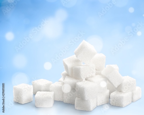 Cubes of sugar on white background