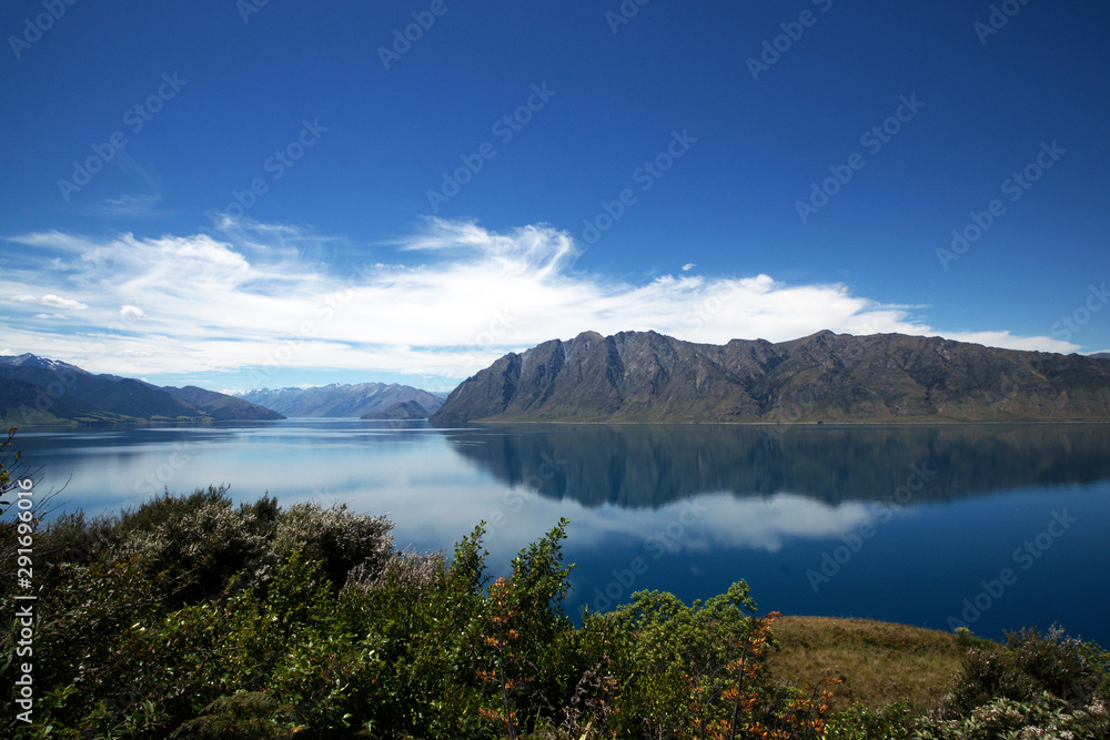 Lake Hayes Mirror lake in the mountains South Island New Zealand Lake Hayes Mirror lake in the mountains South Island New Zealand