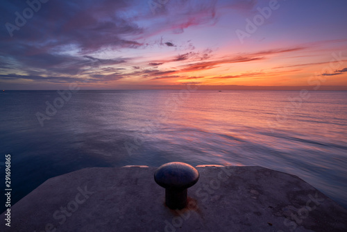 morning sunrise skyline seascape with sea dock