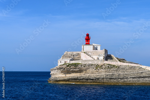 Little red old lighthouse on a rock near Bonifacio Corsica