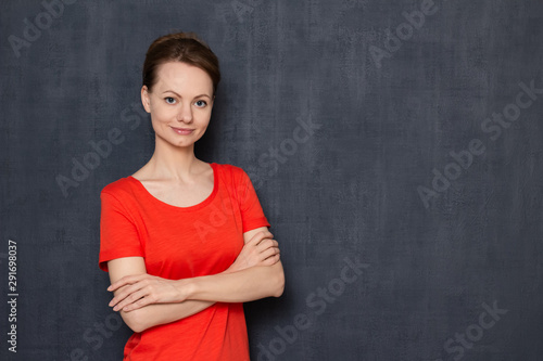 Portrait of happy woman holding arms crossed on chest